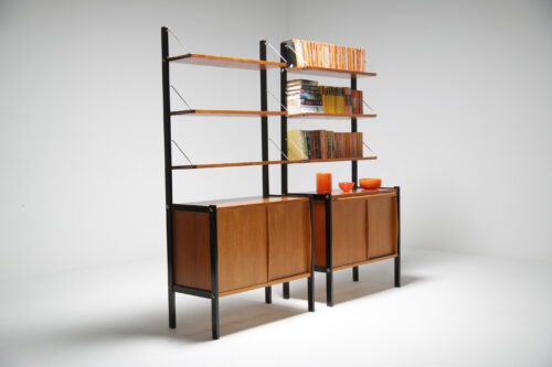 A Pair of teak bookcases with ebonised sides. 3